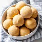 No-bake peanut butter balls without chocolate on a striped napkin – easy 3-ingredient snack.